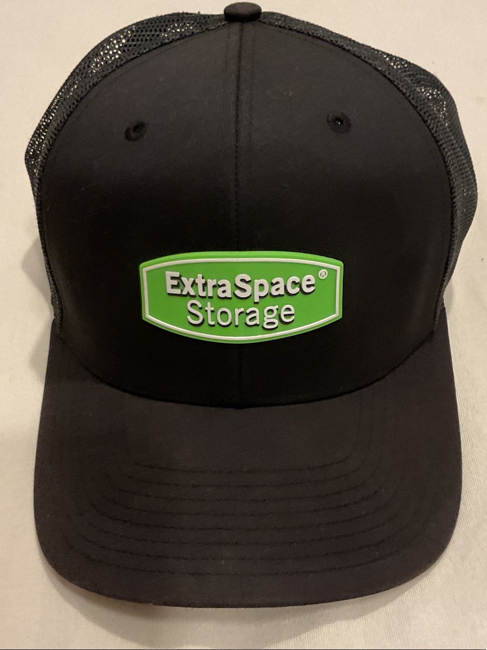 Extra Space Storage Black Trucker Cap with Green Logo